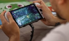 A gamer plays a video game on a Nintendo Switch console, OLED model during Paris Games Week 2022 at Parc des Expositions Porte de Versailles on November 03, 2022 in Paris, France. 