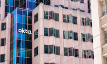 Okta sign, logo on headquarters building of software company