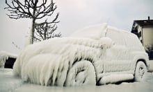 A car frozen over with ice.