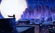 An animation still of a tiny Batman standing above Gotham City which is snowing.