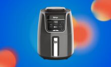 ninja xl air fryer on blue background with hazy red dots
