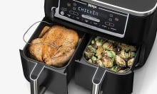 ninja dual air fryer cooking chicken and brussels sprouts