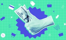 hand holding money on a colorful background