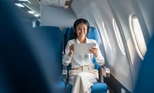 woman using tablet on a plane