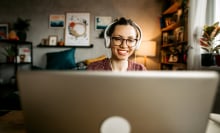 woman with headphones on computer