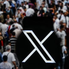 X logo in a crowd