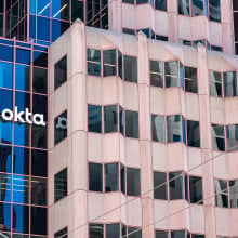 Okta sign, logo on headquarters building of software company