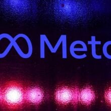 A Meta logo on a neon background.