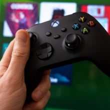 Xbox controller with Xbox Game Pass in the background