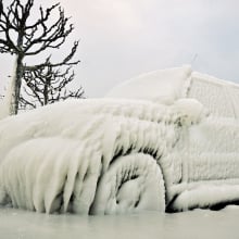 A car frozen over with ice.