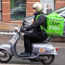 UberEats driver on a scooter