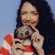 Woman eating chocolate Xbox controller