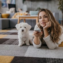 woman and dog watching TV