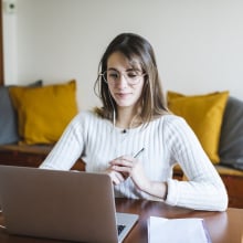 woman using computer for online learning