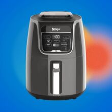 ninja xl air fryer on blue background with hazy red dots