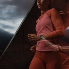 person running while wearing pink apple watch series 9