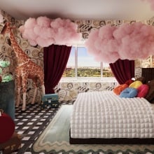 A "Wonka"-themed hotel room, including a bed with a chocolate bar headboard and cotton candy clouds.