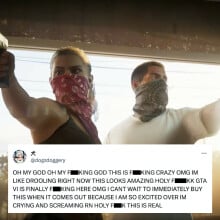 A screenshot of the 'Grand Theft Auto VI' trailer, showing Lucia and her male partner bursting into a store. Both have guns held aloft, while their faces are hidden by bandanas. Superimposed on top is a censored post by X user @dogzdoggery, which reads in all caps, "OH MY GOD OH MY FUCKING GOD THIS IS FUCKING CRAZY OMG IM LIKE DROOLING RIGHT NOW THIS LOOKS AMAZING HOLY FUCKKK GTA VI IS FINALLY FUCKING HERE OMG I CANT WAIT TO IMMEDIATELY BUY THIS WHEN IT COMES OUT BECAUSE I AM SO EXCITED OVER IM CRYING AND SCREAMING RN HOLY FUCK THIS IS REAL"