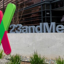 A sign in front of a building reads "23andMe"