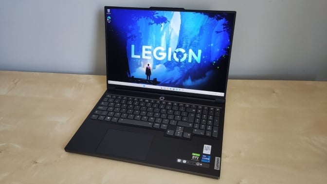 Lenovo Legion Slim 7i gaming laptop on desktop with open screen