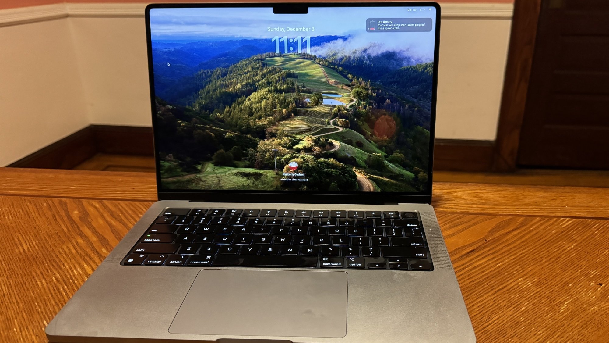 M3 14-inch MacBook Pro on a table on lock screen