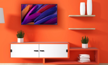 roku smart tv on an orange wall