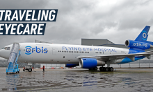 A long shot shows the side of Orbis's Flying Eye Hospital plane. Caption reads "traveling eyecare."