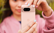 a close-up of a woman taking a photo with a google pixel 8