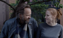 Jessica Chastain and Peter Sarsgaard looking at each other and smiling in 'Memory.'