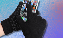 gloved hands using smartphone