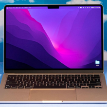 a 13-inch m2 apple macbook air against a cloud-patterned background