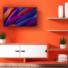 roku smart tv on an orange wall