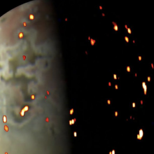 The reds, yellows, and whites overlaid on this image of Jupiter's volcanic moon Io show areas where heat is radiating from the surface.