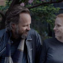 Jessica Chastain and Peter Sarsgaard looking at each other and smiling in 'Memory.'