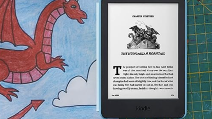 The 2022 Kindle Kids laying next to a dragon drawing, open to a book chapter